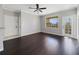 Bright living room with hardwood floors, a ceiling fan, neutral walls, and access to a balcony at 2624 Robert Trent Jones Dr # 634, Orlando, FL 32835