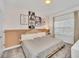 Charming bedroom with stylish decor, neutral colors, and a comfortable bed at 3007 Penelope Loop, Kissimmee, FL 34746