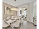 Dining area with a modern chandelier and sliding glass doors to the patio at 3007 Penelope Loop, Kissimmee, FL 34746