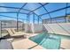 Enjoy poolside relaxation in this screened-in pool with lounge chairs and sunny views at 3007 Penelope Loop, Kissimmee, FL 34746