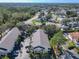 Aerial view of well-maintained community featuring mature trees, lush landscaping, and ample parking at 3206 Sabal Palms Ct # A, Kissimmee, FL 34747