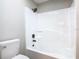 Bright bathroom features a white tub and shower combination with updated, modern fixtures at 3206 Sabal Palms Ct # A, Kissimmee, FL 34747