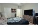 Bedroom featuring ample closet space, large TV, and a relaxing atmosphere perfect for restful nights at 3364 Westchester Square Blvd # 104, Orlando, FL 32835