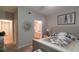 Calm and inviting main bedroom with a plush bed and doorway leading to the bathroom at 3364 Westchester Square Blvd # 104, Orlando, FL 32835