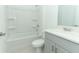 Clean, well-lit bathroom with a shower-tub combo, modern vanity, and toilet at 338 Wayland Dr, Haines City, FL 33844