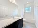 Bathroom with modern vanity, quartz countertop and subway tile shower at 340 Bahia Cir, Longwood, FL 32750