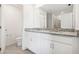 Modern bathroom featuring white cabinets, a gray granite countertop, and tiled floors at 3507 Salvia Ct, Tavares, FL 32778