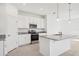 Modern kitchen featuring white cabinets, granite countertops, and stainless steel appliances at 3507 Salvia Ct, Tavares, FL 32778