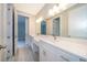 Bathroom features a double vanity and large mirror at 39 N Sunset Dr, Casselberry, FL 32707