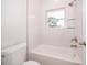 Bright white bathroom with tub and shower at 39 N Sunset Dr, Casselberry, FL 32707