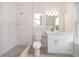 Modern bathroom with glass-enclosed shower and vanity at 39 N Sunset Dr, Casselberry, FL 32707