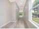 Long hallway with wood floors and window at 39 N Sunset Dr, Casselberry, FL 32707