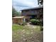 Exterior shot of the home's backyard showcasing a wooden enclosure at 40201 Jericho Trl, Eustis, FL 32736