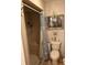 A functional bathroom features a shower and toilet with classic decor at 40201 Jericho Trl, Eustis, FL 32736