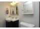 Bathroom with modern vanity, framed mirror, chrome fixtures, and stylish towel racks at 4117 Fairview Vista Pt # 105, Orlando, FL 32804