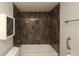 Bathroom featuring modern tile in shower and bathtub and chrome fixtures at 4117 Fairview Vista Pt # 105, Orlando, FL 32804