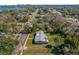 Aerial view of the home in a quiet residential neighborhood, surrounded by mature trees at 4228 Lenox Blvd, Orlando, FL 32811