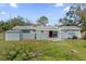 This home features a spacious backyard with a shed, ideal for outdoor activities and storage at 4228 Lenox Blvd, Orlando, FL 32811