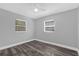 Bedroom featuring hardwood floors and two bright windows at 4228 Lenox Blvd, Orlando, FL 32811