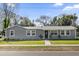 Charming single-story home featuring a well-manicured lawn and a freshly painted exterior at 4228 Lenox Blvd, Orlando, FL 32811