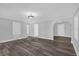 Open-concept living room with hardwood floors and seamless transition to other living spaces at 4228 Lenox Blvd, Orlando, FL 32811