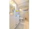 Well-lit bathroom featuring a vanity with a sink and shower stall with sliding doors at 4416 Flagg St, Orlando, FL 32812