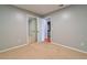 This bedroom features neutral carpet, closet with mirrored sliding doors, and access to an ensuite bathroom at 4416 Flagg St, Orlando, FL 32812