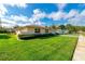 Beautifully landscaped front yard featuring a lush green lawn and mature, manicured shrubs at 4416 Flagg St, Orlando, FL 32812