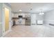 Bright kitchen featuring stainless steel appliances, tile floors, and white cabinetry for a clean, modern look at 4416 Flagg St, Orlando, FL 32812