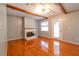 Inviting living room features hardwood floors, a fireplace, and ample natural light, perfect for relaxing and entertaining at 4416 Flagg St, Orlando, FL 32812