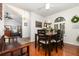 Cozy dining room featuring hardwood floors and a rustic-chic table setting at 445 Autumn Oaks Pl, Lake Mary, FL 32746