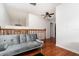 Upstairs hallway with a gray couch and a ceiling fan at 445 Autumn Oaks Pl, Lake Mary, FL 32746