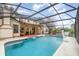 Enclosed pool featuring outdoor seating, fan, and well-maintained pool area at 445 Autumn Oaks Pl, Lake Mary, FL 32746