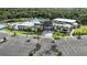 An aerial view of the clubhouse complex with multiple pools, lush landscaping and ample parking at 4759 Cloister St, Kissimmee, FL 34758