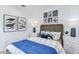 Charming bedroom featuring shark themed decor, wood bed frame, and side tables with lamps at 4759 Cloister St, Kissimmee, FL 34758