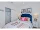 Bedroom featuring soccer-themed decor, including prints and a plush bed with colorful pillows at 4759 Cloister St, Kissimmee, FL 34758