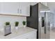 Close-up of a modern kitchen with stainless steel refrigerator and ample counter space with decorative accents at 4759 Cloister St, Kissimmee, FL 34758