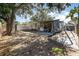 View of the home's backyard, landscaping, and play area at 537 Martin Place Blvd, Apopka, FL 32712