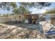 View of the home's backyard patio area and mature landscaping at 537 Martin Place Blvd, Apopka, FL 32712