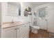 Clean bathroom with a granite sink and a modern toilet at 537 Martin Place Blvd, Apopka, FL 32712