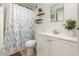 Bathroom with a shower/tub combo, white vanity, and decorative plants at 537 Martin Place Blvd, Apopka, FL 32712