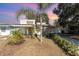 Exterior of the house with palm trees and a front lawn at 537 Martin Place Blvd, Apopka, FL 32712