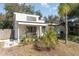 Exterior shot of the house with a covered porch and garden at 537 Martin Place Blvd, Apopka, FL 32712