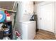 Laundry room with stacked washer and dryer and storage at 537 Martin Place Blvd, Apopka, FL 32712