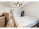 Serene bedroom with wood flooring and a ceiling fan offering a relaxing atmosphere at 537 Martin Place Blvd, Apopka, FL 32712