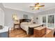 Serene bedroom with hardwood floors, French doors, and natural light at 616 Sheridan Blvd, Orlando, FL 32804