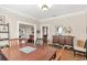 Inviting dining room with hardwood floors, decorative elements, and access to other areas of the home at 616 Sheridan Blvd, Orlando, FL 32804