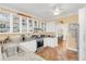 Bright kitchen with white cabinets, granite countertops, and terracotta tile flooring at 616 Sheridan Blvd, Orlando, FL 32804