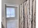 Bedroom entrance with a view of a window with blinds, providing natural light and privacy at 6408 Raleigh St # 2402, Orlando, FL 32835