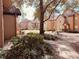 Lush courtyard featuring mature trees, a picnic table, and sidewalks, creating a park-like setting at 6408 Raleigh St # 2402, Orlando, FL 32835